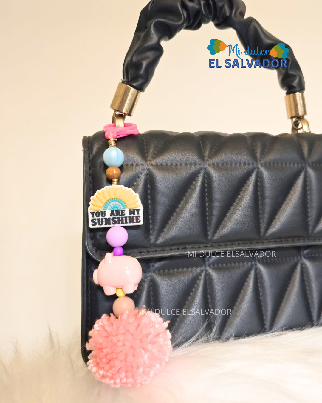 Bag charm cerdito pompón