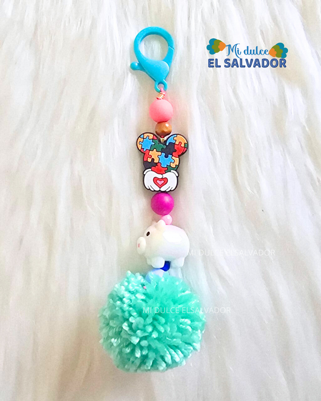 Bag charm cerdito pompón