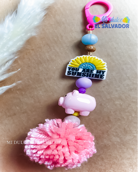 Bag charm cerdito pompón