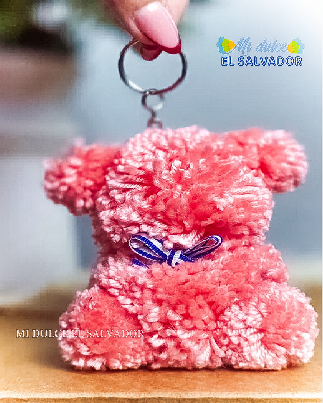 Bag charm osito pompón